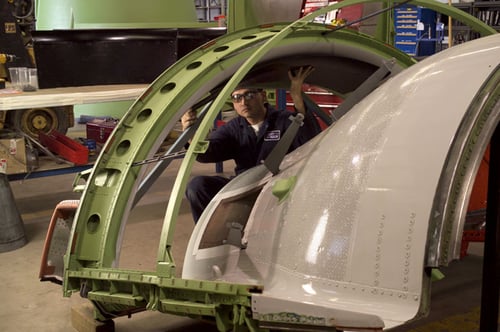 Worker repairing parts